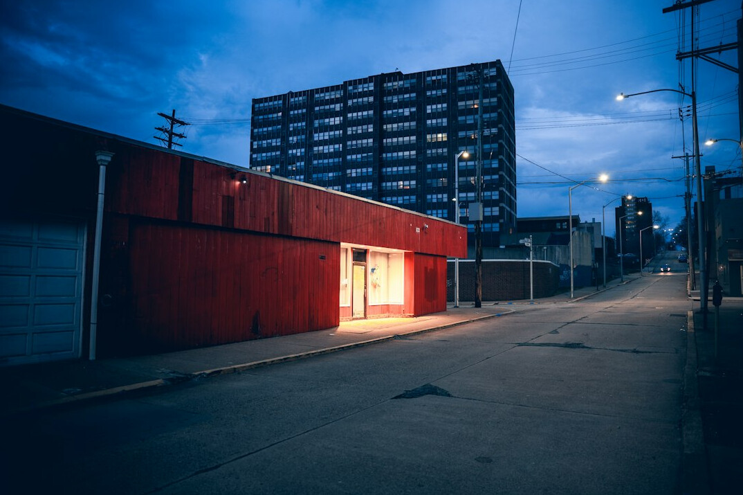 Empty city street at dusk with lights
