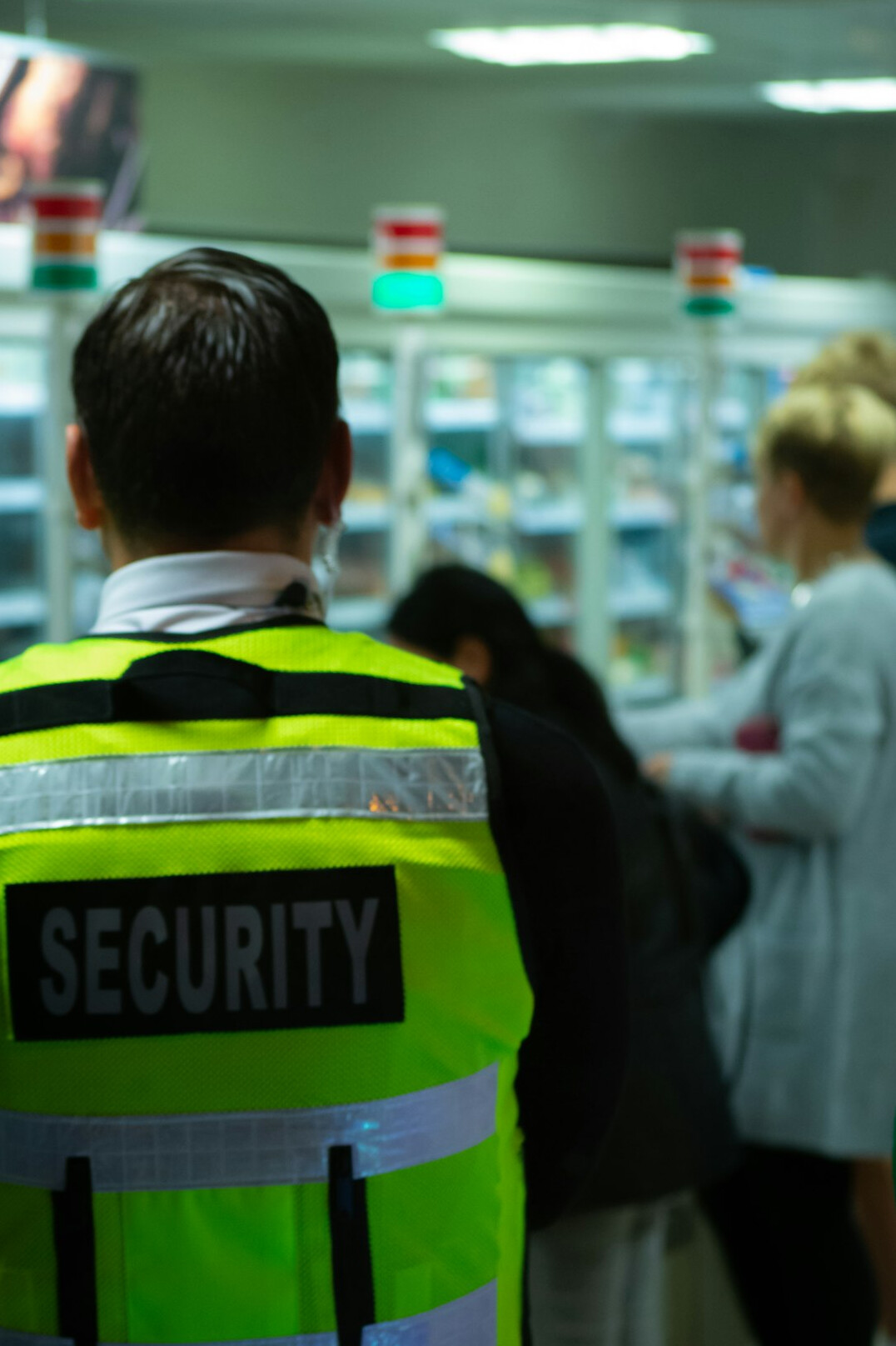 store detective monitoring shoppers
