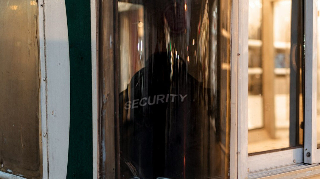 store detective watching camera